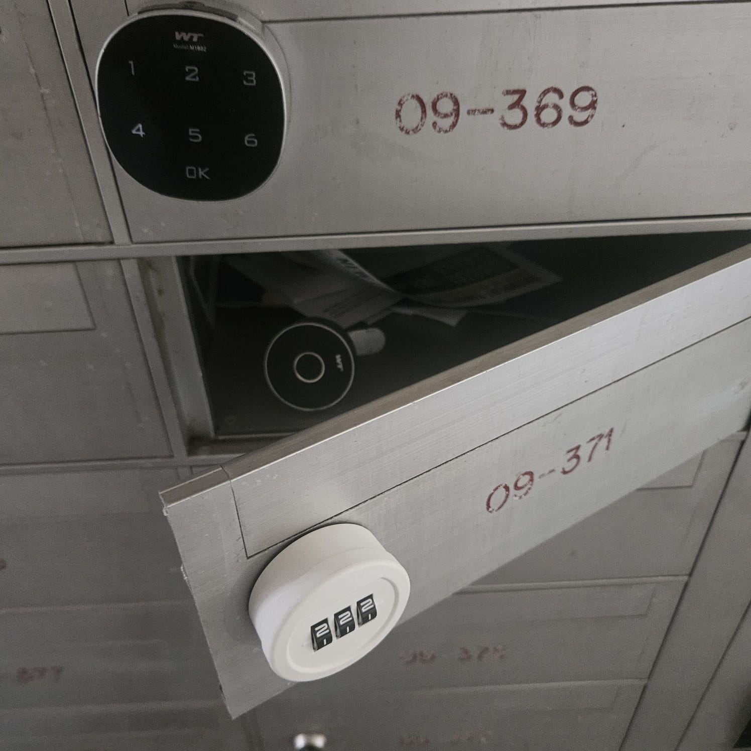 Row of HDB letterboxes after a block-wide lock replacement