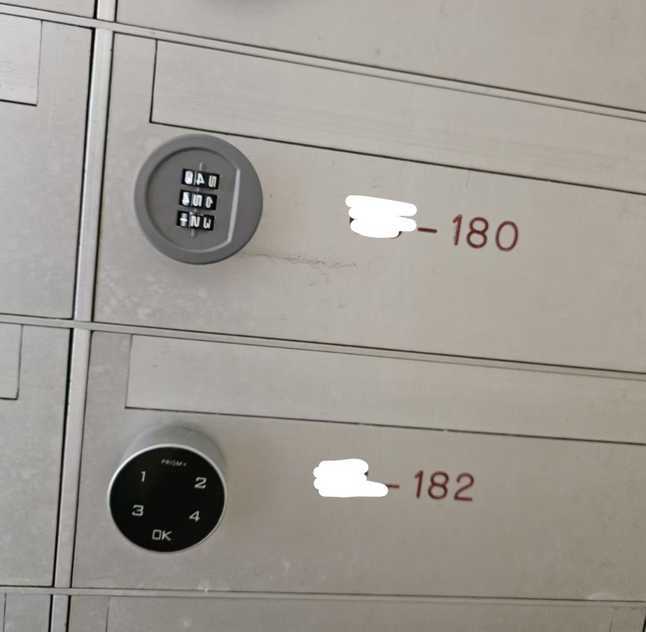 Close-up of a re-keyed HDB mailbox latch after opening