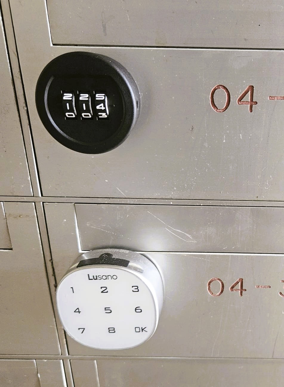 WT touch-PIN digital lock installed on a condominium mailbox